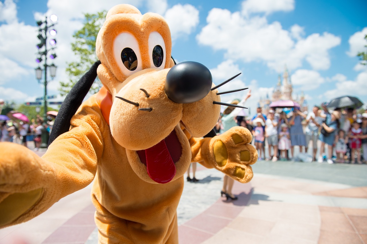 Pluto posing as the mascot for our Disney vacation planning tips.